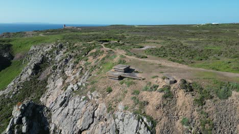 pull-back-drone-aerial-reverse-reveal-cliff-top-German-bunkers-Channel-islands