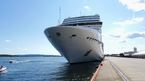 Big-Cruise-Ship-departing-Oslo-Harbour,-Static-Shot-Low-Angle