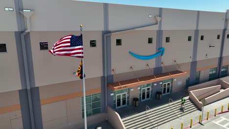 Amazon-fulfillment-center-employee-entering-Amazon-branded-warehouse-in-Glendale,-AZ