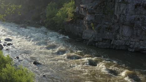 Slow-moving-drone-footage-of-a-rapid-on-the-payette-river-in-Banks,-Idaho