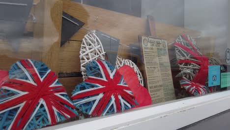 Union-Jacks-woven-over-frames-in-a-window-of-a-shop