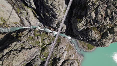 Aerial-Top-Down-View-of-Triftbrucke,-Trift-Bridge,-A-Suspension-Bridge-in-Innertkirchen,-Switzerland