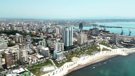 Durres,-promenade,-harbor,-city-buildings,-and-Adriatic-Sea-beach,-view-from-a-drone