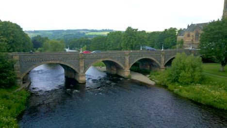 Aerial-Drone-shot-flying-towards-the-Tweed-Bridge-over-the-River-Tweed-in-the-town-of-Peebles-in-the-Scottish-Borders