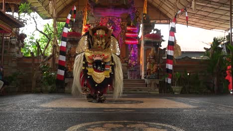 Traditional-Balinese-dance-being-performed-in-theatre-with-costumes-near-Ubud-Indonesia-depicting-a-dragon-from-Hindu-religion