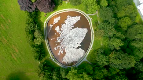Aerial-Drone-slow-vertical-ascent-over-the-Great-Polish-Map-of-Scotland-at-the-village-of-Eddleston,-Scottish-Borders