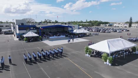Military-ceremony-on-Dominican-republic-airbase-on-a-sunny-summer-day,-aerial