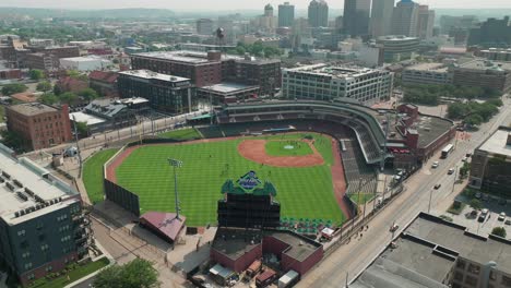 Aerial-reveal-of-downtown-Dayton,-Ohio-and-the-Dayton-Dragons-stadium