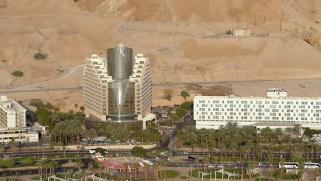 Aerial-footage-of-the-Dead-Sea-hotels-and-beaches-area-,-flying-above-the-salty-water
