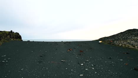 Aerial-View-Of-Black-Volcanic-Ash-Beach-In-Iceland,-mysterious-atmosphere
