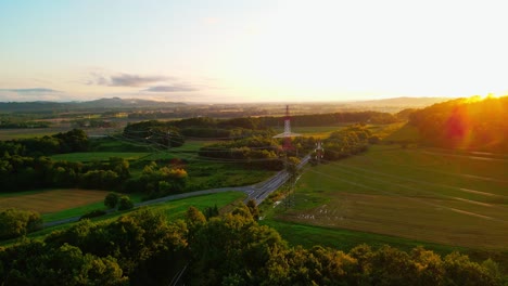 Stunning-4K-drone-footage-of-a-high-voltage-towers-at-sunset-background