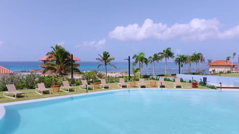 Aerial-flyback-over-pool-and-deckchairs-of-Hilton-Garden-Inn-Hotel-at-La-Romana-in-Dominican-Republic