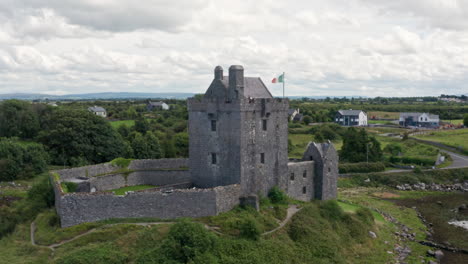 Aerial-Shot-Rotating-Around-Dunguaire-Castle-in-County-Galway,-Ireland
