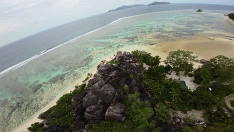 Filming-on-a-Anse-Source-d'Argent-beach-in-Seychelles-on-an-Island-Mahe,-video-of-incredible-trees,-Seychelles-rocks,-seaside,-and-surrounding-Seychelles-landscapes