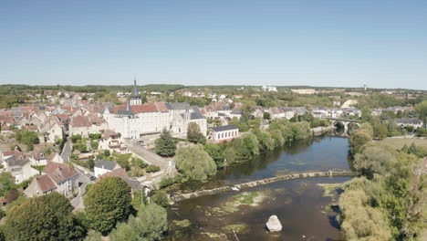 Aerial-drone-point-of-view-of-the-town-of-Saint-Gaultier-on-the-banks-of-the-river-Creuse-in-Indre,-France
