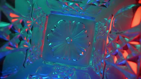 Abstract-macro-background,-transition,-overlay-layer-as-light-passes-through-a-rotating-crystal---straight-down