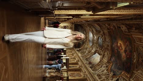 Woman-Tourist-in-Breathtaking-Art-Exhibit-Corridor-of-the-Historic-Louvre-Museum