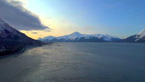 Beautiful-aerial-left-to-right-view-of-Seward-Highway-mountains-at-sunrise