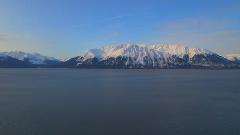 Slow-aerial-view-of-beautiful-mountains-at-sunrise-on-the-Seward-highway