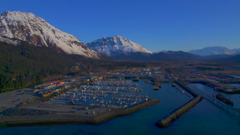 Flying-away-reveal-of-Seward-Boat-Harbor-at-sunrise-tin-Seward-Alaska