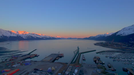 Amazing-drone-view-of-Seward-Alaska-Seward-Boat-Harbor-and-the-mountains-at-sunset