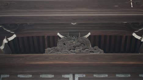Close-up-shot-of-the-imperial-emblem-wooden-gate-in-Kyoto-Japan