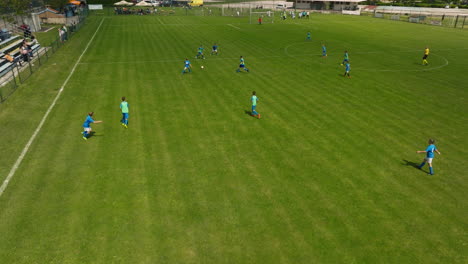 Huge-Soccer-Field-With-Players-Passing-And-Hitting-The-Ball-While-Displaying-Teamwork-In-Krk,-Croatia