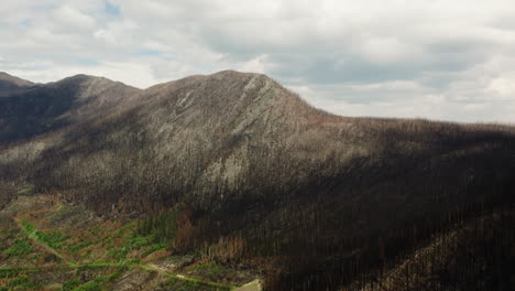 Aerial-arc-shot-of-mountainside-devastated-by-raging-British-Columbia-wildfires