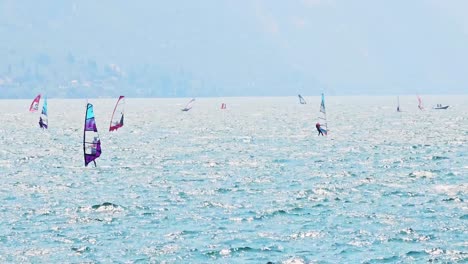 Rookie-windsurfers-practicing-at-Spiaggia-Sabbioni-beach-Riva-del-Garda-Italy