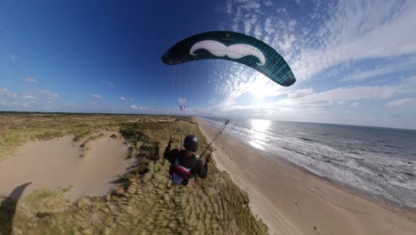 Paraglider,-Extreme-High-Speed-Flying,-Close-to-Beach-and-Bushes,-Black-Kite,-Wide-Angle-Insta360,-Action-Cam,-Blue-Sky,-Summer,-Langevelderslag,-Netherlands