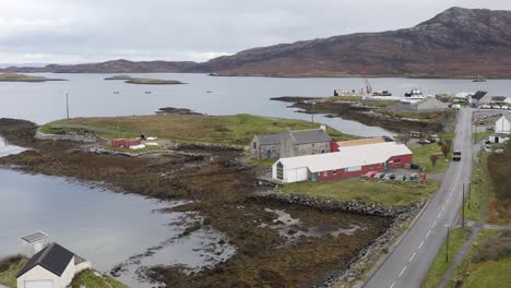 Static-drone-shot-of-the-sea-loch-around-Lochmaddy,-featuring-the-Taigh-Chearsabhagh-Museum-and-Arts-Centre-and-the-nearby-marina
