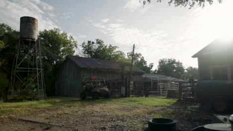 Man-Parks-Work-Vehicle-Outside-of-Barnyard-Early-in-the-Morning-in-Rural-Texas