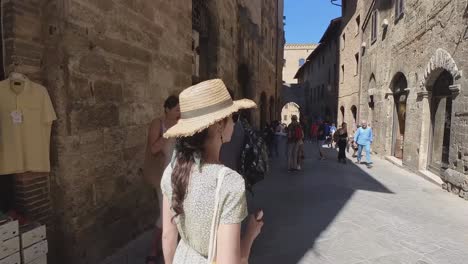 Beautiful-model-walking-within-the-streets-of-san-gimignano