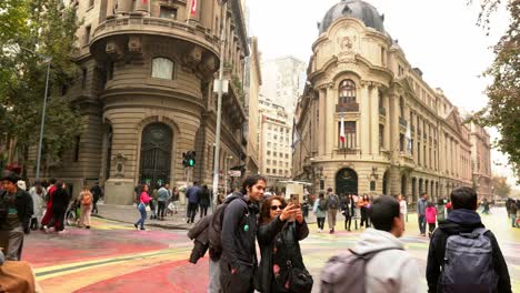 Pan-shot-of-crowded-Bandera-promenade-with-Santiago-Stock-Exchange-during-heritage-day-Celebrations