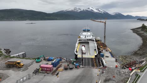 Gate-closing-and-ferry-Rodvenfjord-preparing-for-departure-Afarnes-with-dangerous-cargo-truck-loaded-on-deck