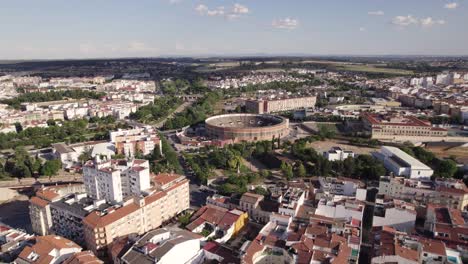 Drone-flyover-Badajoz-city-towards-traditional-bullring-arena,-Spanish-tradition