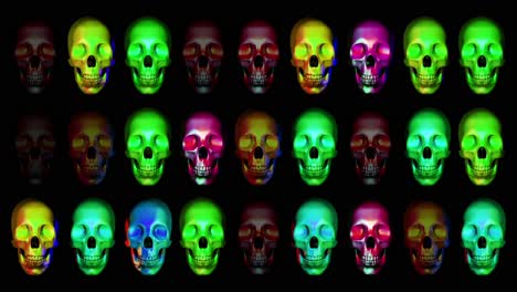 Animation-of-human-skulls,-blinking-in-different-colors-horizontally-in-three-rows,-colorful-candy-animation,-dark-background-good-for-blending-with-alpha-matte-option