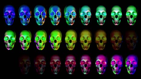 Animation-of-human-skulls,-blinking-in-different-colors-horizontally-in-three-rows,-colorful-presentation,-dark-background-good-for-blending-with-alpha-matte-option
