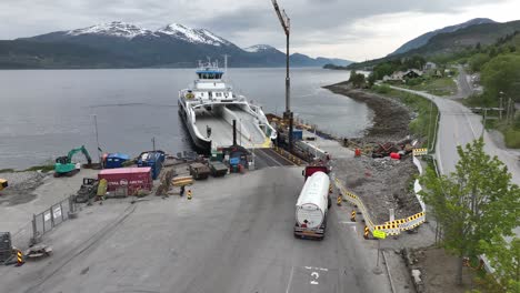 Truck-with-explosive-dangerous-cargo-is-waiting-to-be-loaded-on-to-ferry-deck---Ferry-Rodvenfjord-at-Afarnes-Norway
