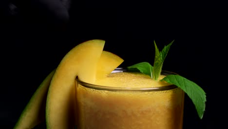 Freshly-squeezed-orange-juice-is-garnished-with-mango-pieces
