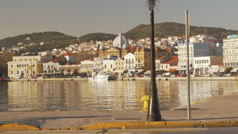 A-woman-crosses-the-street-along-Mytilene-Harbor