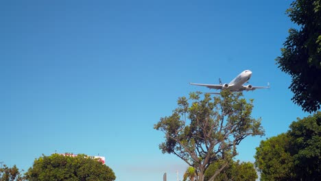 Plane-landing-going-over-the-airplane-park-next-to-In-N-Out-in-Los-Angeles-next-to-LAX-International-airport