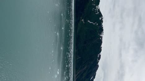 Ice-floating-near-the-coastline-by-Hubbard-Glacier,-Alaska---vertical-orientation