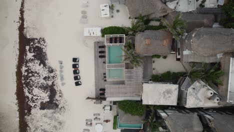 Top-down-aerial-view-of-the-Amansala-resort-and-beach-in-Tulum,-Mexico
