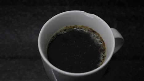 A-hot-cup-of-black-coffee-bubbling