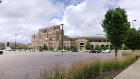Notre-Dame-football-stadium-in-South-Bend,-Indiana-with-gimbal-video-wide-shot-walking-forward