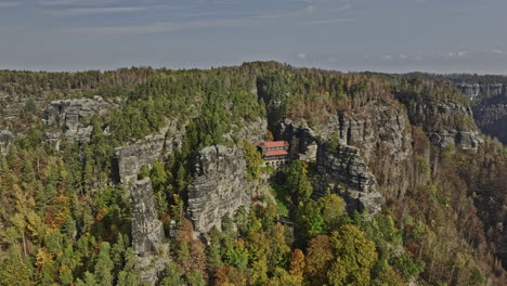 Hrensko-Czechia-Aerial-v3-breathtaking-view,-flyover-hillside-Pravcicka-Archway-and-Falcon's-nest-capturing-spectacular-rock-formation-in-Bohemian-Switzerland---Shot-with-Mavic-3-Cine---November-2022