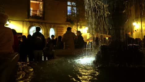 People-Gather-at-Libertad-Town-Square-Fountain-Cobblestone-Street-Santiago-Chile-at-Night-Concha-y-Toro-Neighborhood