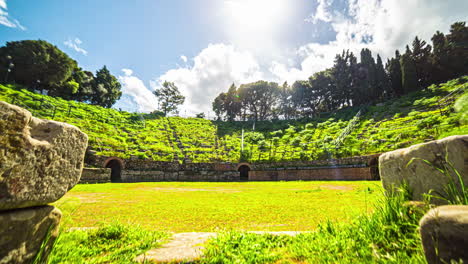 time-lapse-over-the-ruins-of-an-ancient-Roman-amphitheatre-overgrown-with-grass
