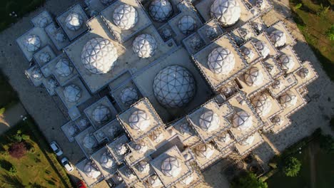 Top-down-aerial-shot-of-famous-library-in-Pristina,-Kosovo